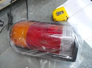 FORD COURIER LEFT TAILLIGHT UTE WELL BACK 06/85-05/91 85 86 87 88 89 90 91 - Picture 1 of 2