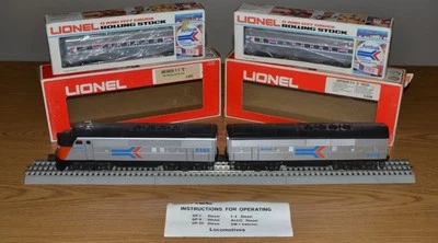 LIONEL 6-8466 & 6-8474 LN AMTRAK F-3 AB DIESEL + 6-6410 & 6-6411 P. CARS - VIDE0 - Image 1 of 4