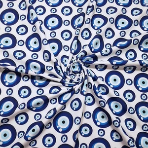 Tela con estampado Evil Eye Nazar - Ojos azul marino, real y azul claro en blanco 4 vías - Imagen 1 de 10