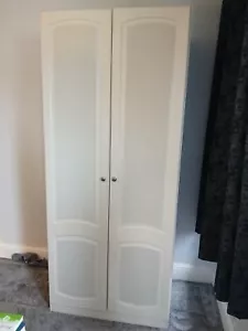 Used Wardrobe for sale. Cream/Off white with patterned doors. Internal shelf. - Picture 1 of 3