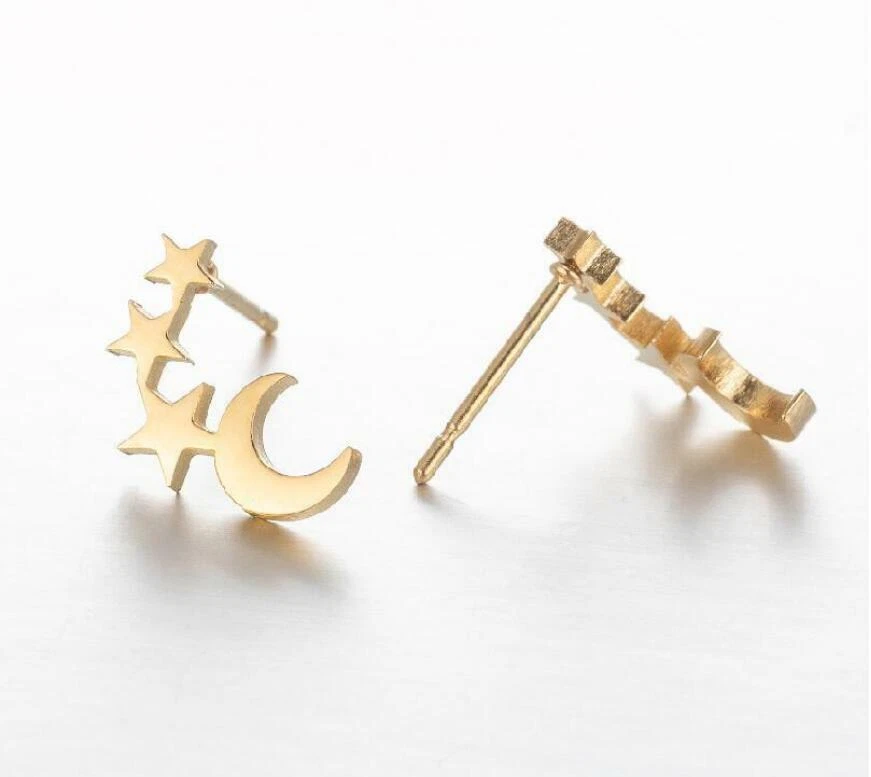 Pequeños aretes de titanio con estrellas y luna creciente de plata/oro Foto 1 de 1