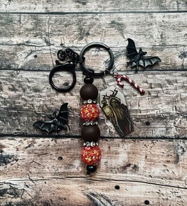 Clip per borsa portachiavi mostro corno gargoyle scuro natalizio - Foto 1 di 3