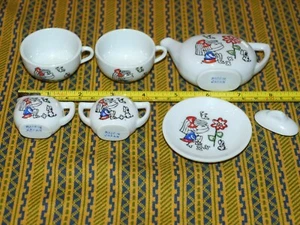 Vintage antikes 7-teiliges Mini-Spielzeug Porzellan-Teeservice für Kinder MÄDCHEN BLUME WELPE hergestellt in Japan - Bild 1 von 2