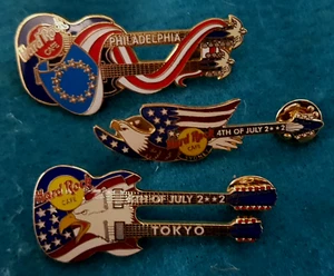 SET 4th JULY SYDNEY TOKYO & PHILADELPHIA FLAG GUITAR Hard Rock Cafe 3 PIN LOT - Bild 1 von 1