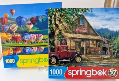 Springbok 1000 Piece Puzzles Lot of 2 "Country General Store"+"Balloon Bonanza" - Image 1 of 4