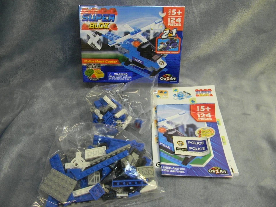 SUPER BLOX POLICÍA HALCÓN HELICÓPTERO Y MINIFIGURA KIT DE 124 PIEZAS POR CRA-Z-ART-SIN USAR, EN CAJA Foto 1 de 4