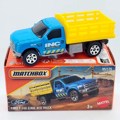 Camión Matchbox Ford F-350 con plataforma de estacas "construcción INC" (2025 mezcla 6 F básico - Pow Foto 1 de 3