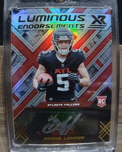 Panini XR Drake London 2022/99 Luminous Endorsements Rookie tinta plateada automática - Imagen 1 de 2