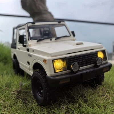 WPL 2.4G 1/10 JIMNY 4WD 370 Motor RC Car Truck Rock Crawler Remote Control Car - Image 1 of 4
