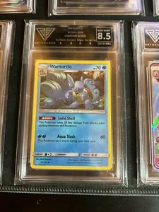 Pokemon Wartortle 34/214 Kosmos Holo Unbroken Bonds GetGraded 8,5 Grade - Bild 1 von 1