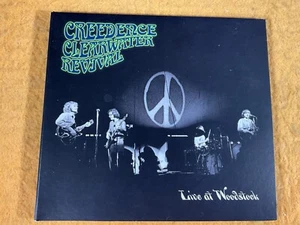 P10-87 CREEDENCE CLEARWATER REVIVAL (CCR) Live At Woodstock - 2019 - CR00219 -CD - Imagen 1 de 6