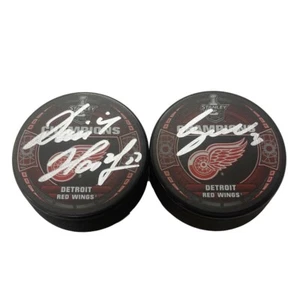 DOMINIK HASEK & CHRIS OSGOOD Signed 2008 SC Champs Pucks (Red Wings Goalies) - Picture 1 of 2