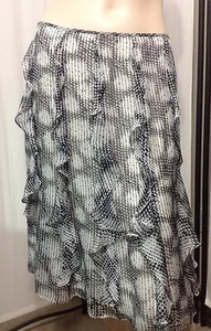 FALDA CON VOLANTES DE SEDA CARMEN MARC VALVO negra y marfil hasta la rodilla falda de carrera 6 - Imagen 1 de 8