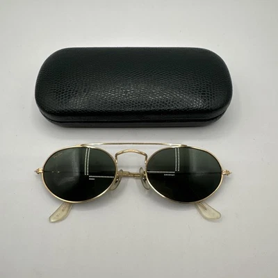 Óculos de sol vintage Ray Ban Bausch & Lomb década de 1980 barra de sobrancelha oval nariz ponte armação dourada - Imagem 1 de 4