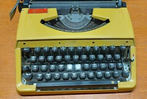 Typewriter Brother 210 ? Charger 11 ?Nagoya Japan yellow vintage 
