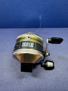 Vintage Zebco Spinner Modell 33 Spin Casting Angelrolle Chrom Schwarz Push LESEN - Bild 1 von 6