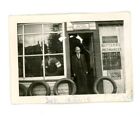 Man at tire shop car automobile vintage snapshot photo  