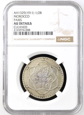 AH 1329 1911 Marruecos 1/2 Rial, París Como Nuevo, NGC AU Detalles - Limpio, KM-Y-24 Foto 1 de 2