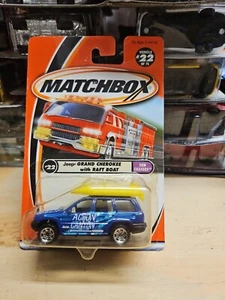 Matchbox 1/64 Diecast Sun Chasers #22/75 Blue Jeep Grand Cherokee With Raft Boat - Picture 1 of 2