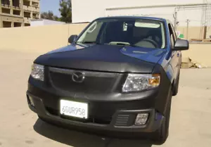 Colgan Front End Mask Bra 2pc.T-STYLE Fits Mazda tribute 2008-2011 With License - Picture 1 of 1