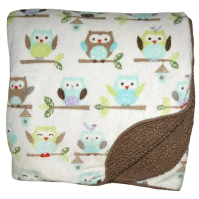 Manta bebé vieja marrón recién nacido en hoja de rama de árbol verde azul usada Foto 1 de 4