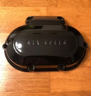 HARLEY DAVIDSON 37126-06 GLOSS BLACK TRANSMISSION SIDE COVER - Image 1 of 4