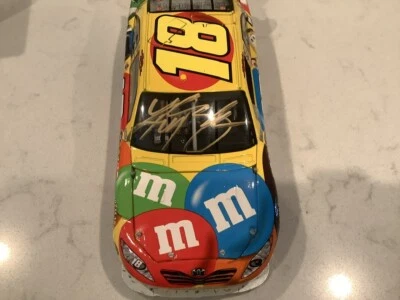 KYLE BUSCH AUTOGRAPHED 2009 TOYOTA CAMRY M&M'S  COT DIECAST & CARD - Image 1 of 4