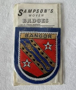 Vintage BANGOR Wales Woven Sew on SAMPSON'S Souvenir Cloth Patch Badge - Imagen 1 de 4