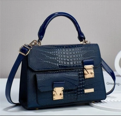 Bolso de mano con hebilla dorada texturizada de cocodrilo de alta calidad Foto 1 de 4