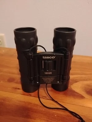 Tasco 10x25mm Binoculars Fully Coated Optics 288. Ft At 1000 Yards - Image 1 of 4