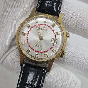 OROLOGIO VINTAGE HELBROS SVEGLIA UOMO WTIST QUADRANTE SUNBURST DATA ANNI 60 CARICA MECCANICA - Foto 1 di 8