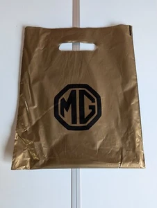 MG Gold Plastiktüte mit schwarzem MG Logo - Bild 1 von 2