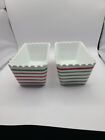 Crate and Barrel ceramic loaf pans in green  and red stripe with ruffled edges.
