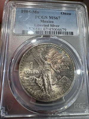 1985 Mexico Toned Silver Libertad Onza NGC MS 67 - Image 1 of 2