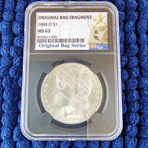 1884-O Morgan Silver Dollar - New Orleans - NGC MS 63 - Original Bag Fragment - Picture 1 of 12