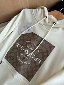 NUEVO CON ETIQUETAS COACH Hombre Mujer Unisex Signature Sudaderas con Capucha Blanco Algodón Orgánico - Imagen 1 de 9