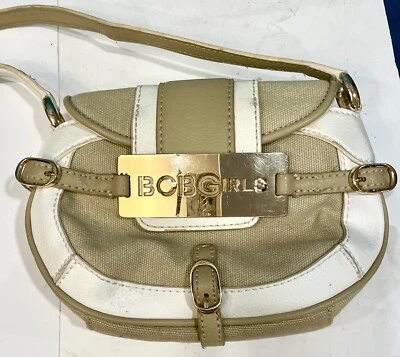 BOLSO DE MANO PEQUEÑO CON SOLAPA DE LONA DE CUERO REAL BLANCO Y BRONCEADO BCBGirls de colección Foto 1 de 4