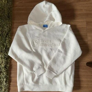 Sudadera con Capucha Tokyo Disney Resort 2023 Logo Tokyo DisneyLand Blanca Talla Grande - Imagen 1 de 1