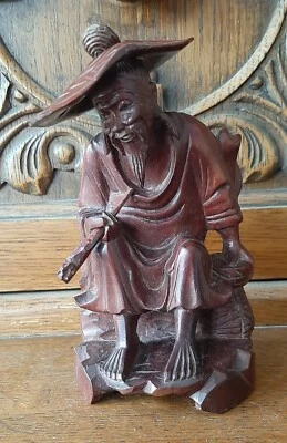 Vintage Rosewood Figurine Oriental Man; wearing hat & holding a pipe. - Image 1 of 4