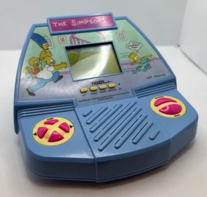 TESTED The Simpsons Electronic LCD Game Tabletop Tiger w/ Battery Cover WORKING - Picture 1 of 5