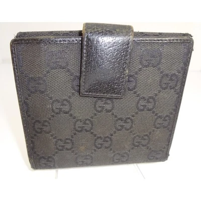 Cartera Gucci GG Monograma Lona Doble Plegable Interior Cuero Negro Foto 1 de 4