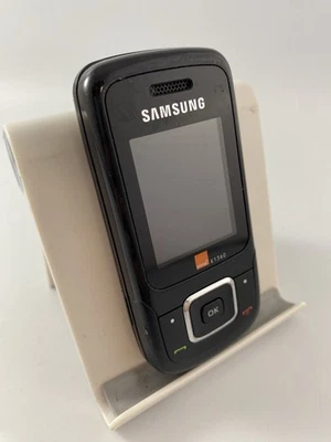Samsung E1360 Black Orange Network 4MB 1.77" GSM Mobile Slide Phone - Image 1 of 4