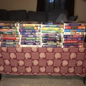 Lot of 36 DISNEY VHS Animated/Live Action Movies Tapes Mickey Clamshell - Picture 1 of 1