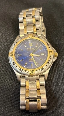 Reloj Hombre Vintage Años 90 Fossil Cara Azul 100 Metros Acero Inoxidable y Dorado AM 3197 Foto 1 de 4
