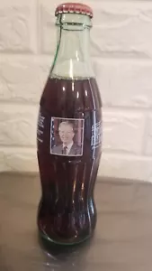 8 OZ COCA COLA COMMEMORATIVE BOTTLE - 2002 PLAINS INN AND ANTIQUES JIMMY CARTER - Picture 1 of 5