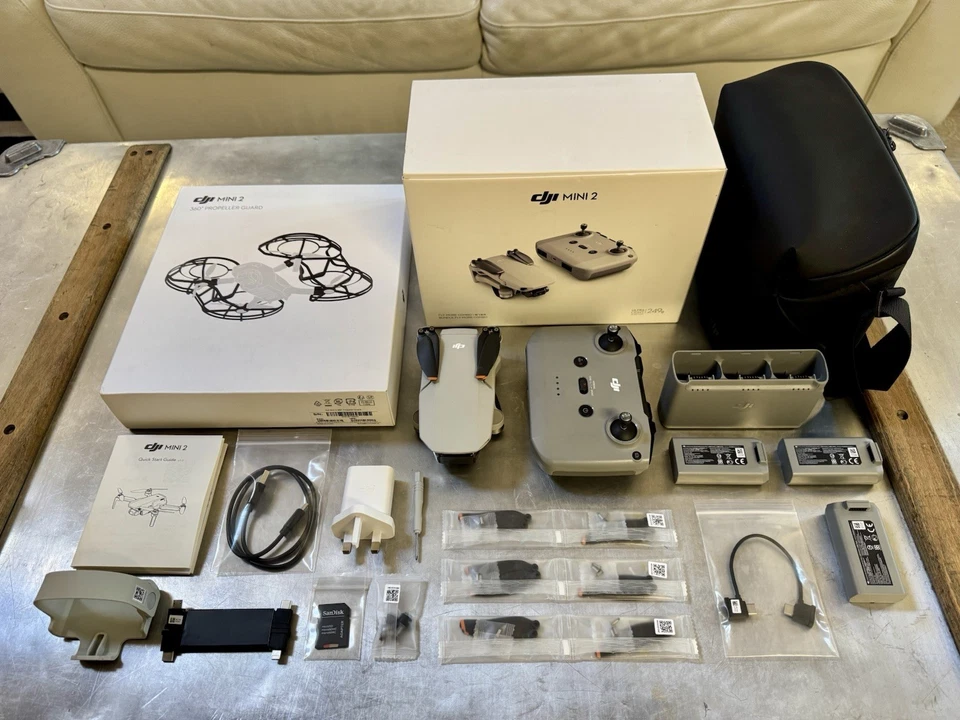 Look… DJI Mini 2 Drone Fly More Combo Bundle + 360 Propeller Guard - Used Once - Image 1 of 4