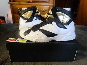 Air Jordan 7 Retro Championship Pack Champaign 2015 WHT/MTLLC GLD-BLK 725093 140 - Bild 1 von 15