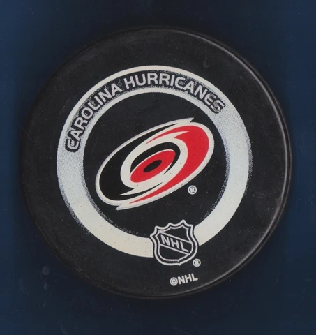 2002-04 Carolina Hurricanes Official NHL Game Puck Shaded Silver Ring series Cover