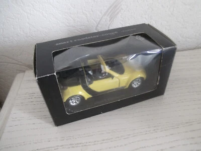 Smart Roadster Coupe gelb 1:43 Modellauto Pullback Sammlermodell - Bild 1 von 4