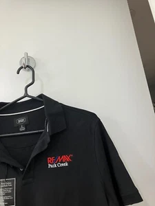 Polo de golf REMAX Re Max Real Estate negro algodón pima para hombre mediano nuevo con etiquetas - Imagen 1 de 1